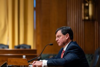 00dc-taxman-01-fcjh-mediumSquareAt3X