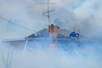 Country-Fire-Authority-CFA-members-douse-a-home-in-Longwood-VIC-bdhf14ep-1