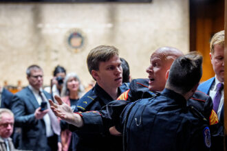 05xp-protester-01-wmcz-mediumSquareAt3X