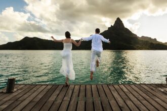 Couple-jumping-into-water